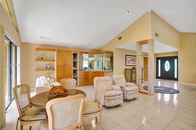 53 Northwoods Ln, Boynton Beach, FL 33436 - dining room featuring vaulted ceiling and light tile patterned floors