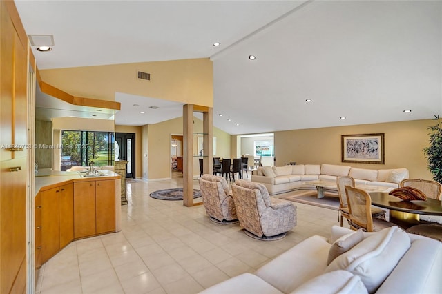 53 Northwoods Ln, Boynton Beach, FL 33436 - living room with healthy amount of natural light, light tile patterned floors, and high vaulted ceiling