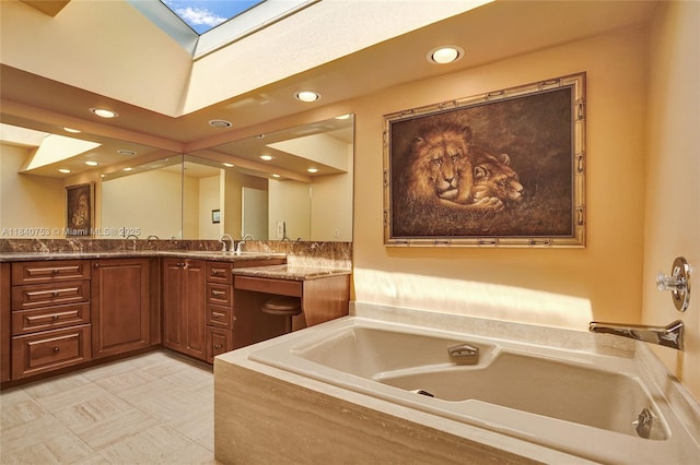 53 Northwoods Ln, Boynton Beach, FL 33436 - full bath featuring double vanity, a skylight, a garden tub, and recessed lighting