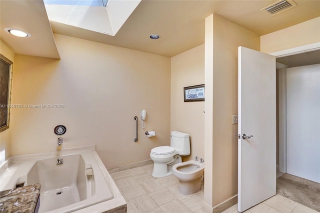 53 Northwoods Ln, Boynton Beach, FL 33436 - bathroom featuring a bidet, a garden tub, a skylight, and recessed lighting
