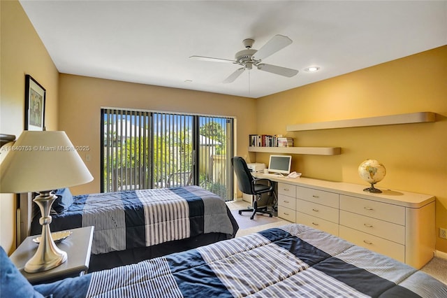 53 Northwoods Ln, Boynton Beach, FL 33436 - carpeted bedroom with access to outside, built in desk, and a ceiling fan
