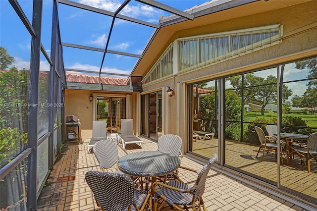 53 Northwoods Ln, Boynton Beach, FL 33436 - sunroom with lofted ceiling and outdoor dining space