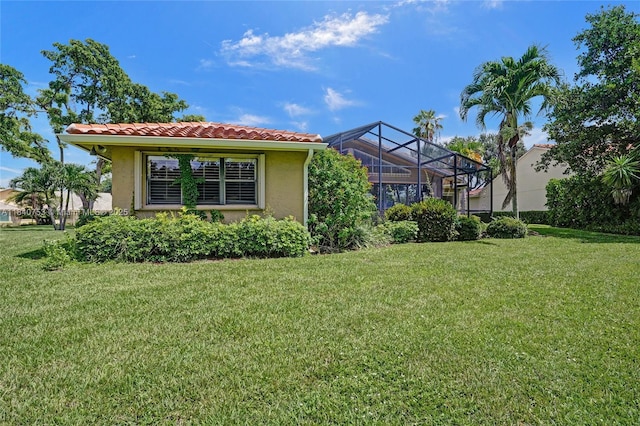53 Northwoods Ln, Boynton Beach, FL 33436 - rear view of property with stucco siding, a yard, and a tile roof