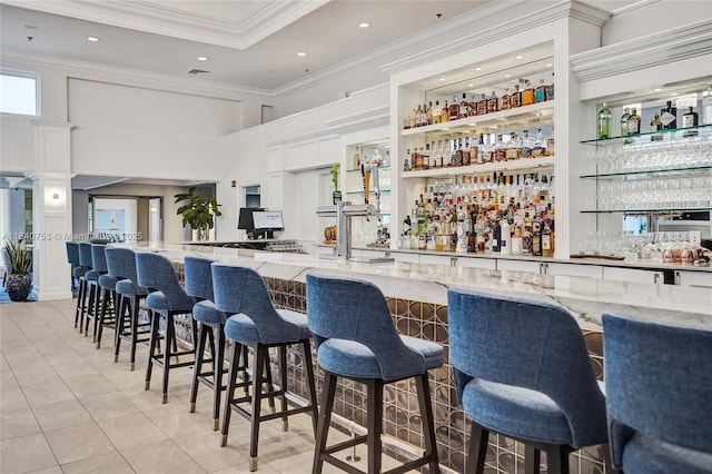 53 Northwoods Ln, Boynton Beach, FL 33436 - indoor wet bar featuring ornamental molding, light tile patterned flooring, a high ceiling, and recessed lighting