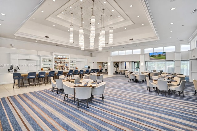 53 Northwoods Ln, Boynton Beach, FL 33436 - carpeted dining room featuring a raised ceiling, a towering ceiling, recessed lighting, and tile patterned floors