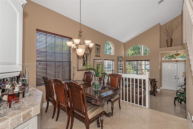 2188 NW 158th Ave, Pembroke Pines, FL 33028 - dining space with a chandelier, light tile patterned flooring, and high vaulted ceiling