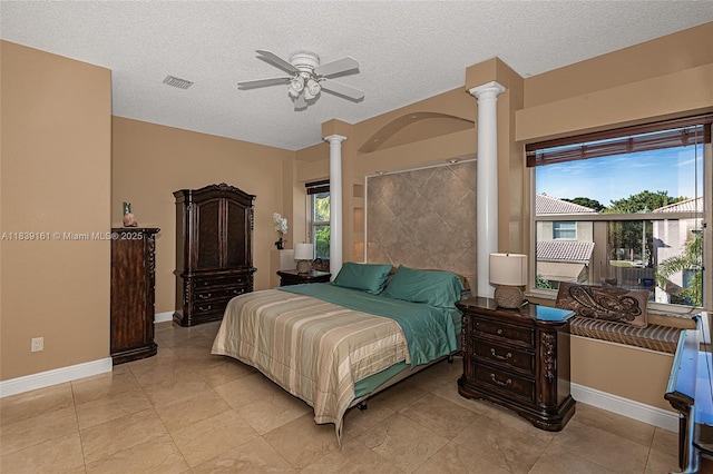 2188 NW 158th Ave, Pembroke Pines, FL 33028 - bedroom with decorative columns, a textured ceiling, ceiling fan, and light tile patterned floors