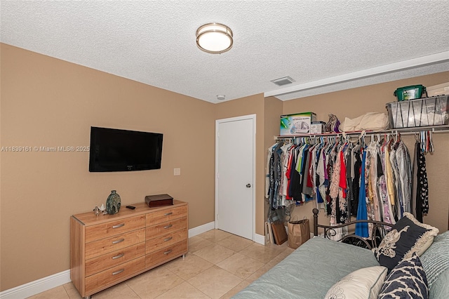 2188 NW 158th Ave, Pembroke Pines, FL 33028 - bedroom with light tile patterned flooring and a textured ceiling