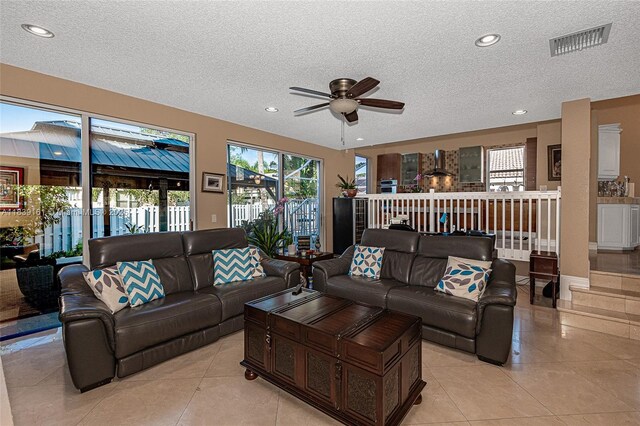 2188 NW 158th Ave, Pembroke Pines, FL 33028 - living room with a ceiling fan, a textured ceiling, light tile patterned floors, and recessed lighting