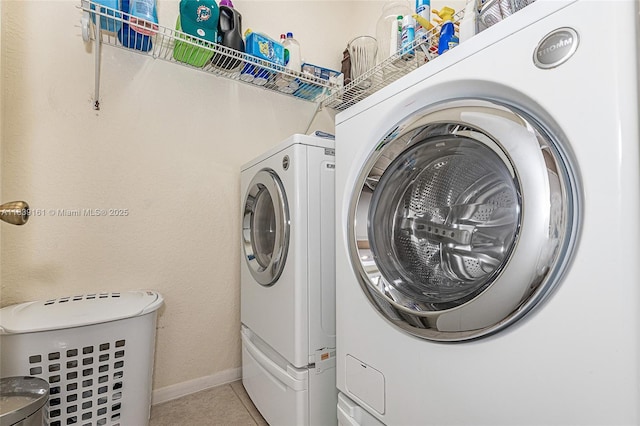 2188 NW 158th Ave, Pembroke Pines, FL 33028 - laundry area with washer and clothes dryer and light tile patterned floors