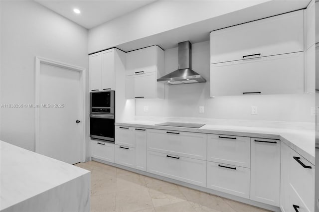 3758 SW 50th Ct, Hollywood, FL 33312 - kitchen featuring wall chimney exhaust hood, light countertops, white cabinetry, light marble finish flooring, and recessed lighting