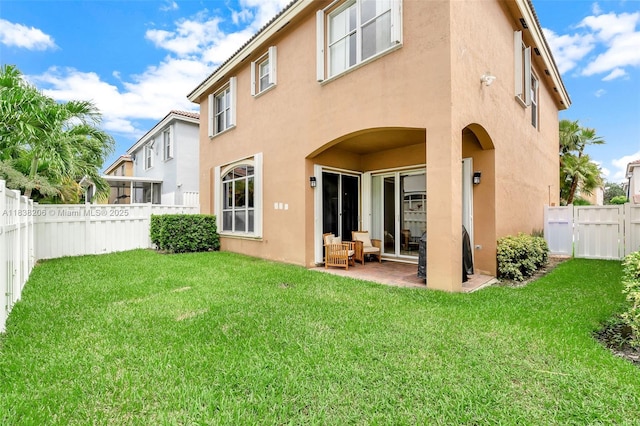 3758 SW 50th Ct, Hollywood, FL 33312 - back of property with stucco siding, a patio area, and a fenced backyard