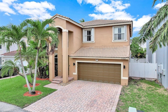 3758 SW 50th Ct, Hollywood, FL 33312 - mediterranean / spanish house with stucco siding, a garage, decorative driveway, and a tiled roof
