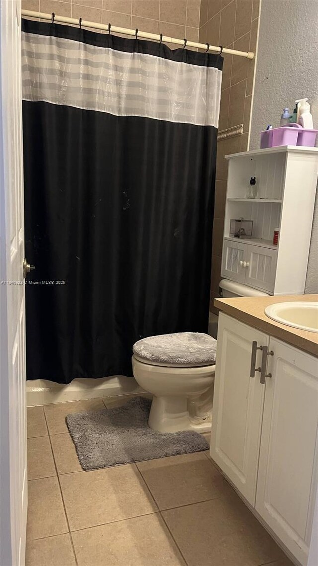 9087 SW 153rd Ct, Miami, FL 33196 - bathroom with vanity, tile patterned floors, a textured wall, and a shower with shower curtain