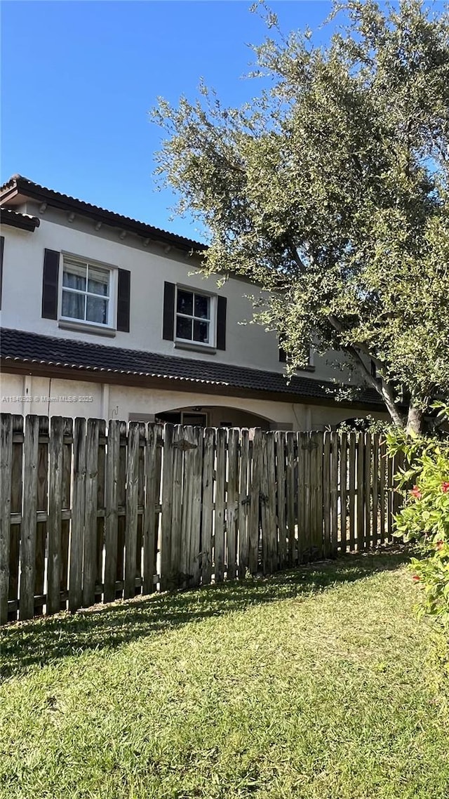 9087 SW 153rd Ct, Miami, FL 33196 - back of property featuring stucco siding and a tile roof