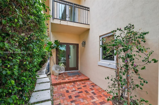3166 Indiana St Unit I, Miami, FL 33133 - entrance to property featuring french doors, stucco siding, and a balcony