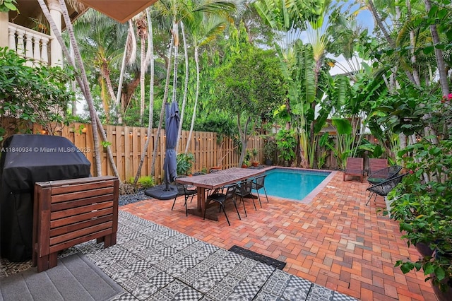 3166 Indiana St Unit I, Miami, FL 33133 - view of pool featuring outdoor dining area, grilling area, a patio, and a fenced backyard