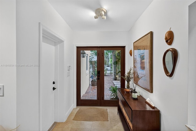 3166 Indiana St Unit I, Miami, FL 33133 - foyer featuring french doors and light tile patterned floors