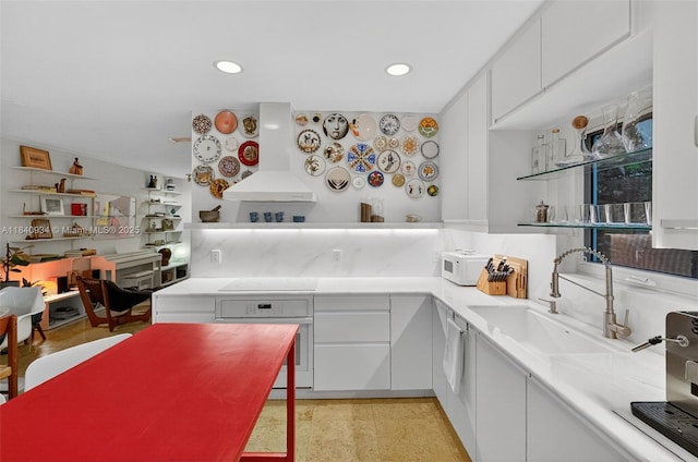 3166 Indiana St Unit I, Miami, FL 33133 - kitchen with white appliances, light countertops, wall chimney range hood, white cabinets, and recessed lighting