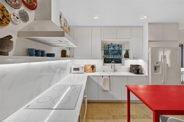 3166 Indiana St Unit I, Miami, FL 33133 - kitchen featuring custom range hood, fridge with ice dispenser, white electric stovetop, light countertops, and recessed lighting