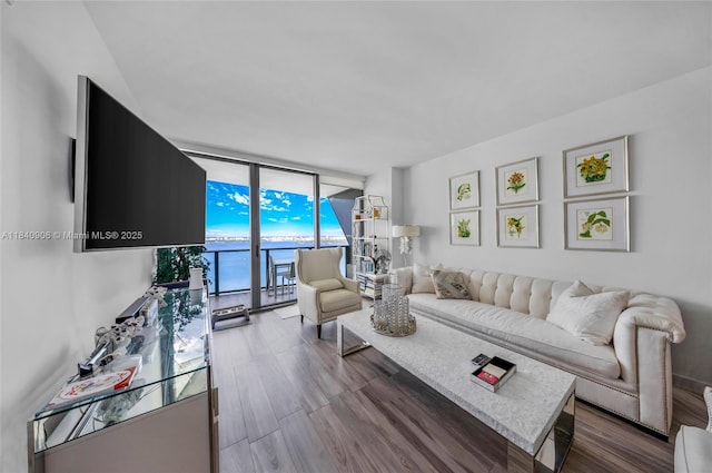 460 NE 28th St Unit 3905, Miami, FL 33137 - living room featuring a wall of windows and dark wood finished floors