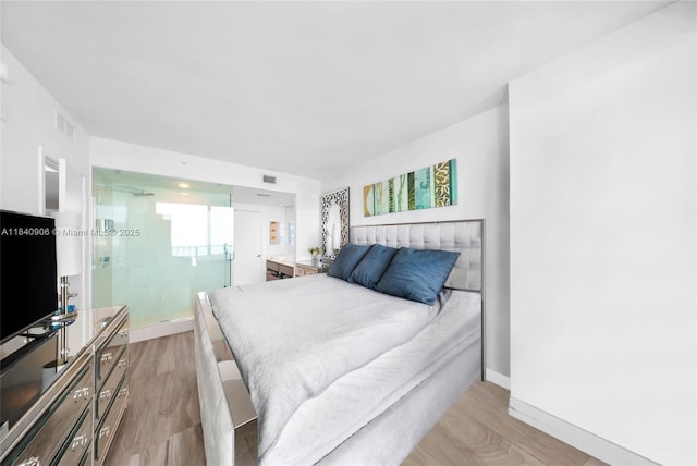 460 NE 28th St Unit 3905, Miami, FL 33137 - bedroom featuring wood finished floors and baseboards