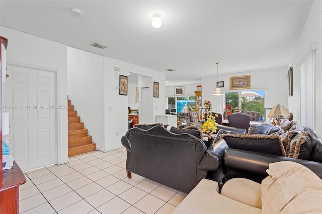 3135 NE 4th St, Homestead, FL 33033 - living room featuring stairway and light tile patterned floors