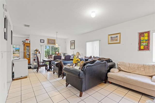 3135 NE 4th St, Homestead, FL 33033 - living area with light tile patterned floors and healthy amount of natural light