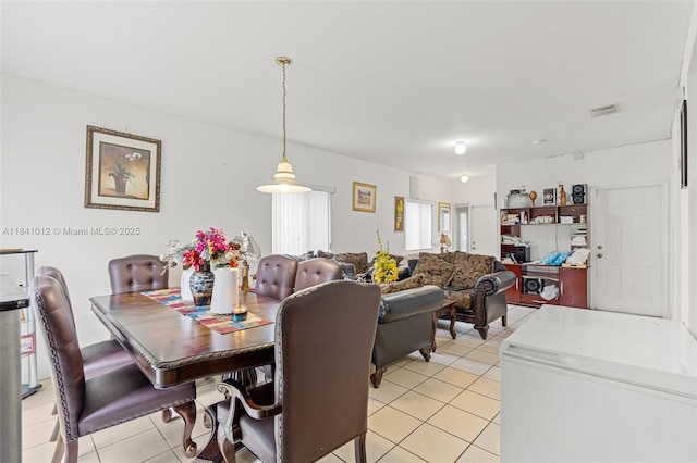 3135 NE 4th St, Homestead, FL 33033 - dining area featuring light tile patterned flooring