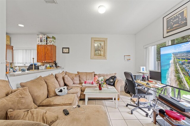 3135 NE 4th St, Homestead, FL 33033 - living area with light tile patterned floors, a desk, and recessed lighting