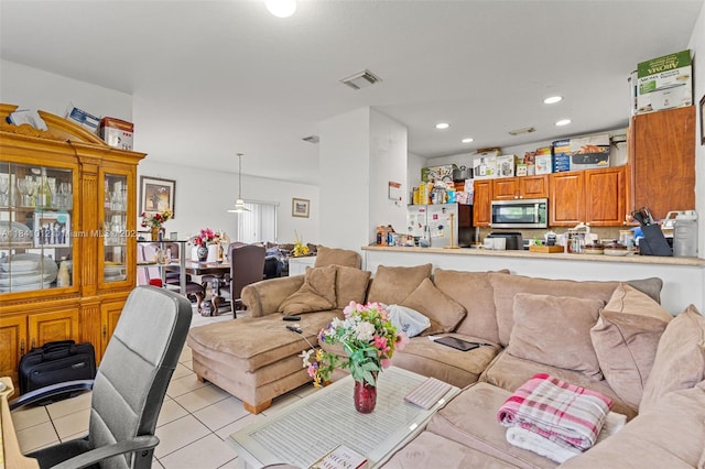 3135 NE 4th St, Homestead, FL 33033 - living area with light tile patterned flooring and recessed lighting