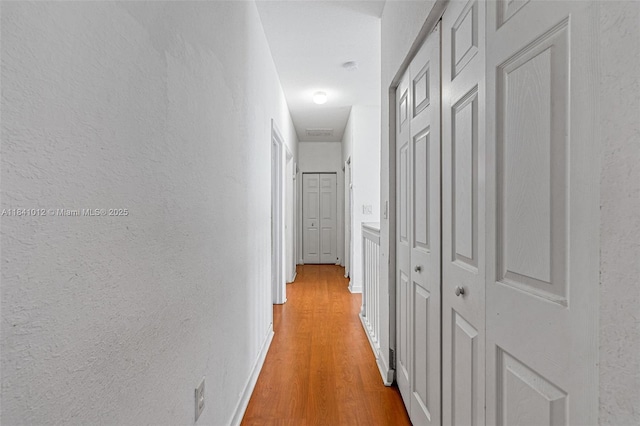 3135 NE 4th St, Homestead, FL 33033 - hall featuring light wood-type flooring and a textured wall