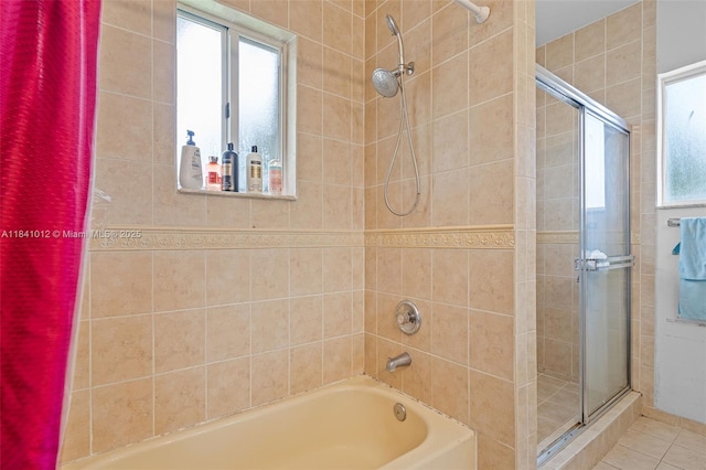3135 NE 4th St, Homestead, FL 33033 - bathroom featuring a tile shower, plenty of natural light, a tub, and tile patterned flooring
