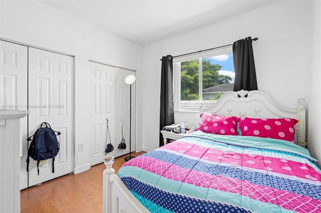 3135 NE 4th St, Homestead, FL 33033 - bedroom featuring light wood finished floors and multiple closets
