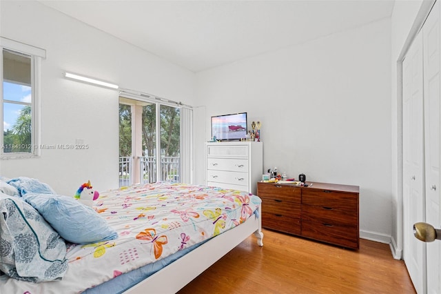 3135 NE 4th St, Homestead, FL 33033 - bedroom featuring wood finished floors, access to outside, and a closet