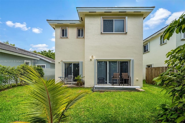 3135 NE 4th St, Homestead, FL 33033 - back of house with stucco siding and a patio