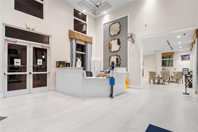 3135 NE 4th St, Homestead, FL 33033 - reception area featuring a towering ceiling, french doors, and recessed lighting