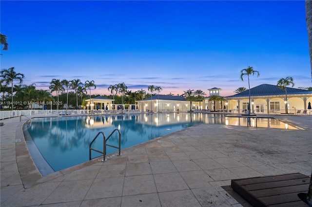 3135 NE 4th St, Homestead, FL 33033 - pool at dusk with a patio area, a community pool, and a gazebo