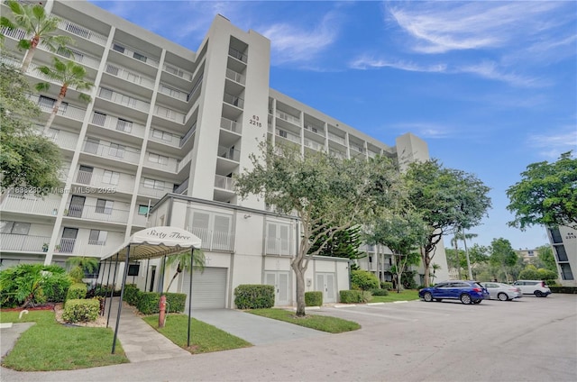 2215 Cypress Island Dr Unit 707, Pompano Beach, FL 33069 - view of apartment building / complex featuring uncovered parking