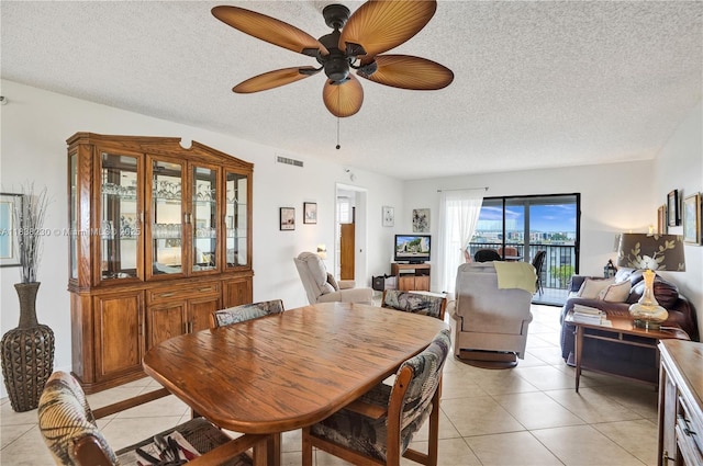 2215 Cypress Island Dr Unit 707, Pompano Beach, FL 33069 - dining room featuring light tile patterned floors, a textured ceiling, and ceiling fan