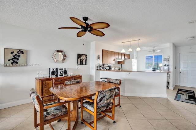 2215 Cypress Island Dr Unit 707, Pompano Beach, FL 33069 - dining area with a ceiling fan, a textured ceiling, and light tile patterned floors