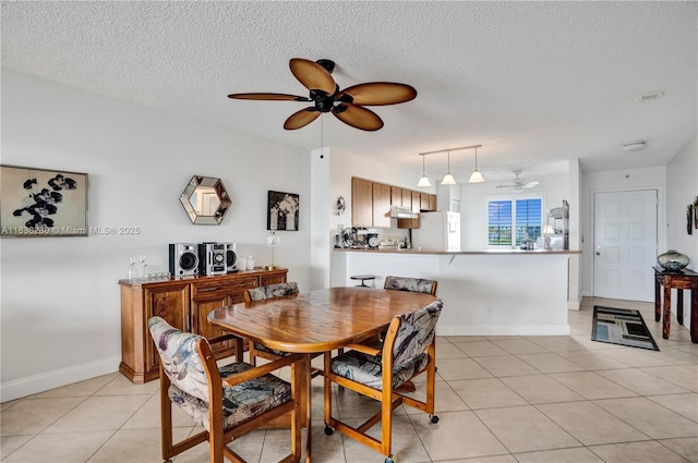 2215 Cypress Island Dr Unit 707, Pompano Beach, FL 33069 - dining area with a ceiling fan, light tile patterned floors, and a textured ceiling