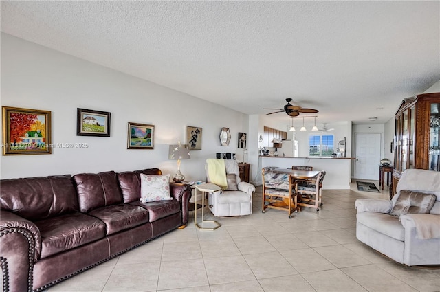 2215 Cypress Island Dr Unit 707, Pompano Beach, FL 33069 - living area with a ceiling fan, light tile patterned floors, and a textured ceiling