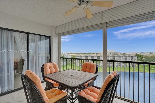 2215 Cypress Island Dr Unit 707, Pompano Beach, FL 33069 - sunroom featuring a ceiling fan and tile patterned flooring