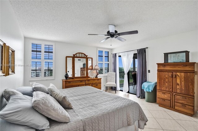 2215 Cypress Island Dr Unit 707, Pompano Beach, FL 33069 - bedroom with access to exterior, light tile patterned floors, a textured ceiling, and ceiling fan