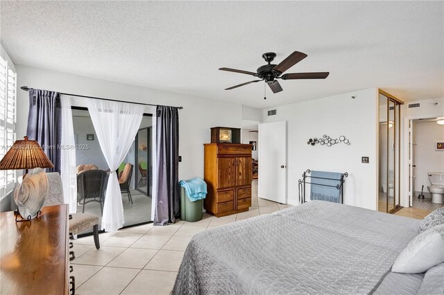 2215 Cypress Island Dr Unit 707, Pompano Beach, FL 33069 - bedroom featuring access to outside, light tile patterned floors, multiple windows, a textured ceiling, and a ceiling fan