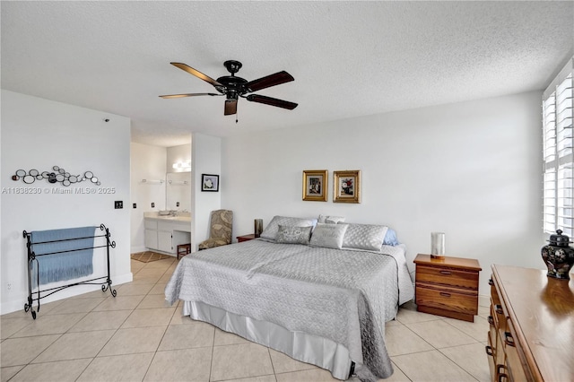 2215 Cypress Island Dr Unit 707, Pompano Beach, FL 33069 - bedroom with light tile patterned flooring, multiple windows, a textured ceiling, and a ceiling fan