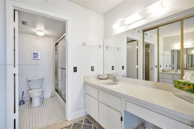2215 Cypress Island Dr Unit 707, Pompano Beach, FL 33069 - bathroom with tile patterned flooring, a stall shower, vanity, and a textured ceiling