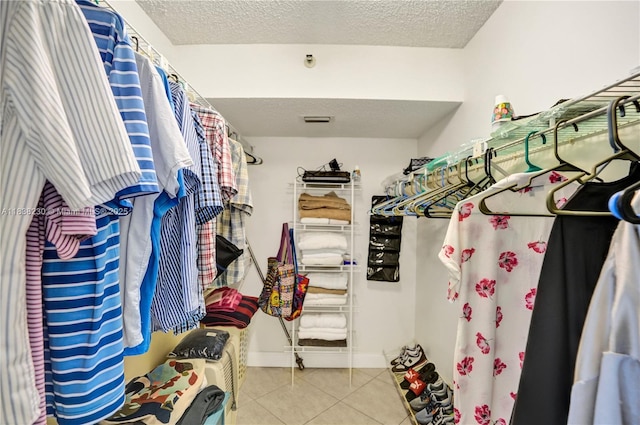 2215 Cypress Island Dr Unit 707, Pompano Beach, FL 33069 - walk in closet with light tile patterned floors