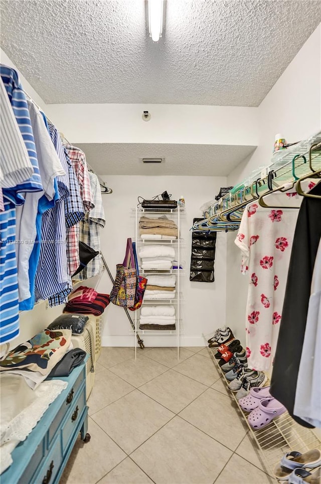 2215 Cypress Island Dr Unit 707, Pompano Beach, FL 33069 - walk in closet featuring light tile patterned flooring